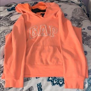 A peach neon gap hoodie